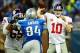 Dec 22, 2013; Detroit, MI, USA; New York Giants quarterback Eli Manning (10) throws a pass while being pressured by Detroit Lions defensive end Ezekiel Ansah (94) during the third quarter at Ford Field. Mandatory Credit: Andrew Weber-USA TODAY Sports