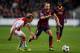 AMSTERDAM, NETHERLANDS - NOVEMBER 26: Christian Poulsen of Ajax and Andres Iniesta of Barcelona battle for the ball during the UEFA Champions League Group H match between Ajax Amsterdam and FC Barcelona at Amsterdam Arena on November 26, 2013 in Amsterda