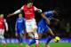 LONDON, ENGLAND - DECEMBER 23: Mesut Oezil of Arsenal and John Obi Mikel of Chelsea compete for the ball during the Barclays Premier League match between Arsenal and Chelsea at Emirates Stadium on December 23, 2013 in London, England. (Photo by Shaun Bot