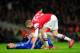 LONDON, ENGLAND - DECEMBER 23: Per Mertesacker of Arsenal helps Fernando Torres of Chelsea to his feet during the Barclays Premier League match between Arsenal and Chelsea at Emirates Stadium on December 23, 2013 in London, England. (Photo by Shaun Bott
