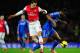 LONDON, ENGLAND - DECEMBER 23: Mesut Oezil of Arsenal and John Obi Mikel of Chelsea compete for the ball during the Barclays Premier League match between Arsenal and Chelsea at Emirates Stadium on December 23, 2013 in London, England. (Photo by Shaun Bot