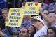 December 11, 2013; Oakland, CA, USA; Golden State Warriors fans hold up signs for Dallas Mavericks shooting guard Monta Ellis (11, not pictured) and Warriors shooting guard Klay Thompson (11, not pictured) during the first quarter at Oracle Arena. The War
