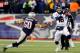 FOXBORO, MA - NOVEMBER 24: Quarterback Peyton Manning #18 of the Denver Broncos is pressured by defensive end Rob Ninkovich #50 of the New England Patriots during a game at Gillette Stadium on November 24, 2013 in Foxboro, Massachusetts. (Photo by Jim Ro