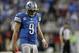 Dec 22, 2013; Detroit, MI, USA; Detroit Lions quarterback Matthew Stafford (9) looks down during overtime against the New York Giants at Ford Field. Giants beat the Lions 23-20. Mandatory Credit: Raj Mehta-USA TODAY Sports