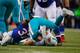 ORCHARD PARK, NY - DECEMBER 22: Ryan Tannehill #17 of the Miami Dolphins is sacked by Nickell Robey #37 of the Buffalo Bills at Ralph Wilson Stadium on December 22, 2013 in Orchard Park, New York. Buffalo won 16-0. (Photo by Rick Stewart/Getty Images)