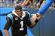 Dec 22, 2013; Charlotte, NC, USA; Carolina Panthers quarterback Cam Newton (1) reacts with fans after the game. The Panthers defeated the Saints 17-13 at Bank of America Stadium. Mandatory Credit: Bob Donnan-USA TODAY Sports