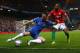 LONDON, ENGLAND - JANUARY 09: Gary Cahill of Chelsea is challenged by Wayne Routledge of Swansea City during the Capital One Cup Semi-Final first leg match between Chelsea and Swansea City at Stamford Bridge on January 9, 2013 in London, England. (Photo