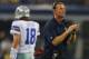 ARLINGTON, TX - AUGUST 24: Head coach Jason Garrett of the Dallas Cowboys on the field as Kyle Orton #18 walks past during a preseason game at AT&T Stadium on August 24, 2013 in Arlington, Texas. (Photo by Ronald Martinez/Getty Images)