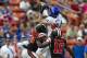 Dec 24, 2013; Honolulu, HI, USA; Boise State Broncos wide receiver Kirby Moore (34) pulls in a pass over Oregon State Beavers safety Ryan Murphy (25) and cornerback Rashaad Reynolds (16) during the 2nd quarter of the 2013 Hawaii Bowl at Aloha Stadium. Man