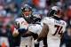 HOUSTON, TX - DECEMBER 22: Peyton Manning #18 of the Denver Broncos celebrates with teammate Champ Bailey #24 after throwing his fourth touchdown during the game against the Houston Texans at Reliant Stadium on December 22, 2013 in Houston, Texas. (Phot