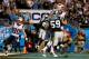CHARLOTTE, NC - NOVEMBER 18: Rob Gronkowski #87 of the New England Patriots and Luke Kuechly #59 of the Carolina Panthers fight for the ball in the end zone on the last play of the game at Bank of America Stadium on November 18, 2013 in Charlotte, North