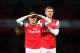 LONDON, ENGLAND - FEBRUARY 02: Laurent Koscielny and Per Mertesacker of Arsenal celebrate defeating Stoke City after the Barclays Premier League match between Arsenal and Stoke City at Emirates Stadium on February 2, 2013 in London, England. (Photo by Mi