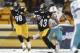Dec 8, 2013; Pittsburgh, PA, USA; Pittsburgh Steelers strong safety Troy Polamalu (43) runs with the ball after a missed Miami Dolphins field goal during the second quarter at Heinz Field. The Miami Dolphins won 34-28. Mandatory Credit: Charles LeClaire-U