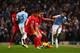 MANCHESTER, ENGLAND - DECEMBER 26: Jesus Navas of Manchester City passes as he is closed down by Jordan Henderson and Philippe Coutinho of Liverpool during the Barclays Premier League match between Manchester City and Liverpool at Etihad Stadium on Decem