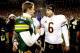 GREEN BAY, WI - JANUARY 02: Quarterback Aaron Rodgers #12 of the Green Bay Packers is congratukated by quarterback Jay Cutler #6 of the Chicago Bears at Lambeau Field on January 2, 2011 in Green Bay, Wisconsin. (Photo by Matthew Stockman/Getty Images)