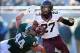 Nov 30, 2013; East Lansing, MI, USA; Minnesota Golden Gophers running back David Cobb (27) is tripped up by Michigan State Spartans defensive end Marcus Rush (44 during the 2nd half a game at Spartan Stadium. MSU won 14-3. Mandatory Credit: Mike Carter-U