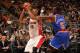 TORONTO, CANADA - OCTOBER 21: DeMar DeRozan #10 of the Toronto Raptors looks to pass the ball against Tim Hardaway Jr. #5 of the New York Knicks during the game on October 21, 2013 at the Air Canada Centre in Toronto, Ontario, Canada. NOTE TO USER: User