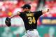 ST LOUIS, MO - OCTOBER 03: Starting pitcher A.J. Burnett #34 of the Pittsburgh Pirates pitches against the St. Louis Cardinals during Game One of the National League Division Series at Busch Stadium on October 3, 2013 in St Louis, Missouri. (Photo by Di