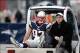 Dec 8, 2013; Foxborough, MA, USA; New England Patriots tight end Rob Gronkowski (87), accompanied by Dr. Thomas Gill, is carted off the field after being injured during the third quarter of New England's 27-26 win over the Cleveland Browns at Gillette Sta