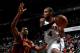 ATLANTA, GA - DECEMBER 06: Paul Millsap #4 of the Atlanta Hawks drives against Andrew Bynum #21 of the Cleveland Cavaliers at Philips Arena on December 6, 2013 in Atlanta, Georgia. NOTE TO USER: User expressly acknowledges and agrees that, by downloadin