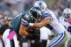 PHILADELPHIA, PA - OCTOBER 20: Tight end Brent Celek #87 of the Philadelphia Eagles makes a first down catch and is tackled by linebacker Sean Lee #50 of the Dallas Cowboys in the fourth quarter during a game at Lincoln Financial Field on October 20, 2013