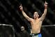 Dec 28, 2013; Las Vegas, NV, USA; Chris Weidman reacts in the cage after defeating Anderson Silva (not pictured) in their UFC middleweight championship bout at the MGM Grand Garden Arena. Mandatory Credit: Jayne Kamin-Oncea-USA TODAY Sports