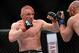 Dec 28, 2013; Las Vegas, NV, USA; Dennis Siver (red gloves) and Manvel Gamburyan (blue gloves) fight during their UFC featherweight bout at the MGM Grand Garden Arena. Mandatory Credit: Jayne Kamin-Oncea-USA TODAY Sports