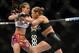 Dec 28, 2013; Las Vegas, NV, USA; Ronda Rousey (red gloves) and Miesha Tate (blue gloves) fight during their UFC women's bantamweight championship bout at the MGM Grand Garden Arena. Mandatory Credit: Jayne Kamin-Oncea-USA TODAY Sports