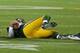 GREEN BAY, WI - NOVEMBER 04: Aaron Rodgers #12 of the Green Bay Packers lays on the ground after being sacked by Shea McClellin of the Chicago Bears at Lambeau Field on November 4, 2013 in Green Bay, Wisconsin. (Photo by Jonathan Daniel/Getty Images)