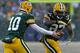 GREEN BAY, WI - DECEMBER 22: Matt Flynn #10 of the Green Bay Packers hands off to Eddie Lacy #27 against the Pittsburgh Steelers at Lambeau Field on December 22, 2013 in Green Bay, Wisconsin. The Steelers defeated the Packers 38-31. (Photo by Jonathan