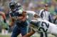 SEATTLE, WA - DECEMBER 29: Running back Marshawn Lynch #24 of the Seattle Seahawks rushes against cornerback Trumaine Johnson #22 of the St. Louis Rams at CenturyLink Field on December 29, 2013 in Seattle, Washington. (Photo by Otto Greule Jr/Getty Imag
