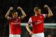 LONDON, ENGLAND - NOVEMBER 02: Laurent Koscielny of Arsenal and Per Mertesacker of Arsenal celebrate victory at the final whistle during the Barclays Premier League match between Arsenal and Liverpool at Emirates Stadium on November 2, 2013 in London, En
