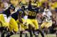 ANN ARBOR, MI - SEPTEMBER 07: Devin Gardner #98 of the Michigan Wolverines hands off to Derrick Green #27 against the Notre Dame Fighting Irish at Michigan Stadium on September 7, 2013 in Ann Arbor, Michigan. (Photo by Gregory Shamus/Getty Images)