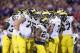 TEMPE, AZ - DECEMBER 28: The Michigan Wolverines huddle around quarterback Shane Morris #7 during the Buffalo Wild Wings Bowl against the Kansas State Wildcats at Sun Devil Stadium on December 28, 2013 in Tempe, Arizona. (Photo by Christian Petersen/Get