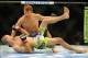 Aug 31, 2013; Milwaukee, WI, USA; Pascal Krauss (bottom) fights Hyun Gyu Lim during the UFC-164 bout at BMO Harris Bradley Center. Mandatory Credit: Benny Sieu-USA TODAY Sports