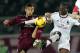 LIVORNO, ITALY - DECEMBER 07: Federico Ceccherini of AS Livorno Calcio fights for the ball with Mario Balotelli of AC Milan during the Serie A match between AS Livorno and AC Milan at Stadio Armando Picchi on December 7, 2013 in Livorno, Italy. (Photo by
