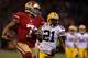 SAN FRANCISCO, CA - JANUARY 12: Quarterback Colin Kaepernick #7 of the San Francisco 49ers runs the ball against strong safety Charles Woodson #21 of the Green Bay Packers during the NFC Divisional Playoff Game at Candlestick Park on January 12, 2013 in