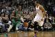 January 16, 2012; Boston, MA, USA; Boston Celtics point guard Rajon Rondo (9) dribbles the ball up court while being defended by Oklahoma City Thunder point guard Russell Westbrook (0) during the fourth quarter at TD Garden. Mandatory Credit: Bob DeChiara