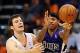 Nov 20, 2013; Phoenix, AZ, USA; Sacramento Kings guard Isaiah Thomas (22) handles the ball against the Phoenix Suns guard Goran Dragic (1) in the second half at US Airways Center. The Kings defeated the Suns 113-106. Mandatory Credit: Jennifer Stewart-USA
