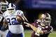 Dec 31, 2013; Atlanta, GA, USA; Texas A&M Aggies quarterback Johnny Manziel (2) carries the ball past Duke Blue Devils linebacker David Helton (47) and Sydney Sarmiento (82) during the third quarter in the 2013 Chick-fil-a Bowl at the Georgia Dome. Manda