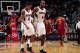 ATLANTA, GA - DECEMBER 6: Jeff Teague #0 and Paul Millsap #4 of the Atlanta Hawks walk off the court during the game against the Cleveland Cavaliers on December 6, 2013 at Philips Arena in Atlanta, Georgia. NOTE TO USER: User expressly acknowledges and