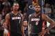 DENVER, CO - DECEMBER 30: Chris Bosh #1 and LeBron James #6 of the Miami Heat look on against the Denver Nuggets on December 30, 2013 at the Pepsi Center in Denver, Colorado. NOTE TO USER: User expressly acknowledges and agrees that, by downloading and/or