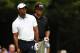 NORTON, MA - AUGUST 31: Tiger Woods and Phil Mickelson of the USA react on the 11th tee during the second round of the Deutsche Bank Championship at TPC Boston on August 31, 2013 in Norton, Massachusetts. (Photo by Jim Rogash/Getty Images)