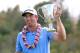 KAPALUA, HI - JANUARY 08: Dustin Johnson celebrates with the Hyundai Tournament of Champions Cup after winning in the final round at the Plantation Course on January 8, 2013 in Kapalua, Hawaii. (Photo by Christian Petersen/Getty Images)