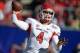 Dec 21, 2013; Las Vegas, NV, USA; Fresno State Bulldogs quarterback Derek Carr (4) throws a pass against the Southern California Trojans in the Las Vegas Bowl at Sam Boyd Stadium. Mandatory Credit: Kirby Lee-USA TODAY Sports