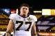 Dec 28, 2013; Tempe, AZ, USA; Michigan Wolverines offensive lineman Taylor Lewan (77) walks off the field following the game against the Kansas State Wildcats during the Buffalo Wild Wings Bowl at Sun Devil Stadium. Kansas State defeated Michigan 31-14. M