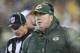 GREEN BAY, WI - DECEMBER 22: Head Coach Mike McCarthy of the Green Bay Packers watches a replay on the scoreboard in the snow during a game against the Pittsburgh Steelers at Lambeau Field on December 22, 2013 in Green Bay, Wisconsin. The Steelers defea