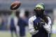 Dec 29, 2013; Seattle, WA, USA; Seattle Seahawks cornerback Richard Sherman catches the ball prior to the game against the St. Louis Rams at CenturyLink Field. Mandatory Credit: Steven Bisig-USA TODAY Sports