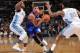 DENVER, CO - January 1: Michael Carter-Williams #1 of the Philadelphia 76ers drives to the basket against the Denver Nuggets on January 1, 2014 at the Pepsi Center in Denver, Colorado. NOTE TO USER: User expressly acknowledges and agrees that, by download