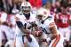 Nov 2, 2013; Fayetteville, AR, USA; Auburn Tigers quarterback Nick Marshall (14) hands off to running back Tre Mason (21) during the first quarter against the Arkansas Razorbacks at Donald W. Reynolds Razorback Stadium. Mandatory Credit: Nelson Chenault-U